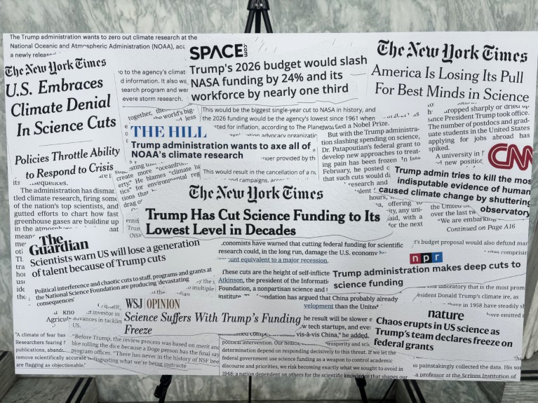 A poster showing cut-outs of headlines from the news media, relating to science grant cuts in the USA.